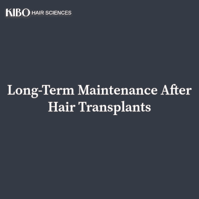 flat lay navy blue background with text "Long-Term Maintenance After Hair Transplants" centred and in middle and on top left corner there is Kibo clinics logo